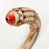 High Jewelry-armbånd – Rosegull, korall, onyx, svart lakk, diamanter – Cartier