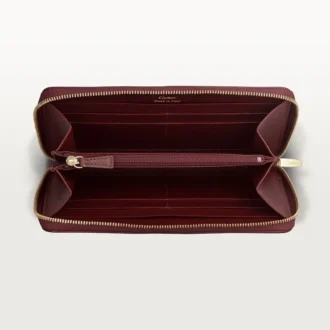 Internasjonal lommebok med glidelås, Must De Cartier – burgunderfarget kalveskinn, gullfinish – Cartier