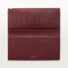 Internasjonal lommebok med gussets, Must De Cartier – svart kalveskinn, rustfritt stålfinish – Cartier