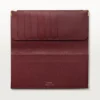 Internasjonal lommebok med sidefolder, Must De Cartier – burgunder kalveskinn, gullfinish – Cartier
