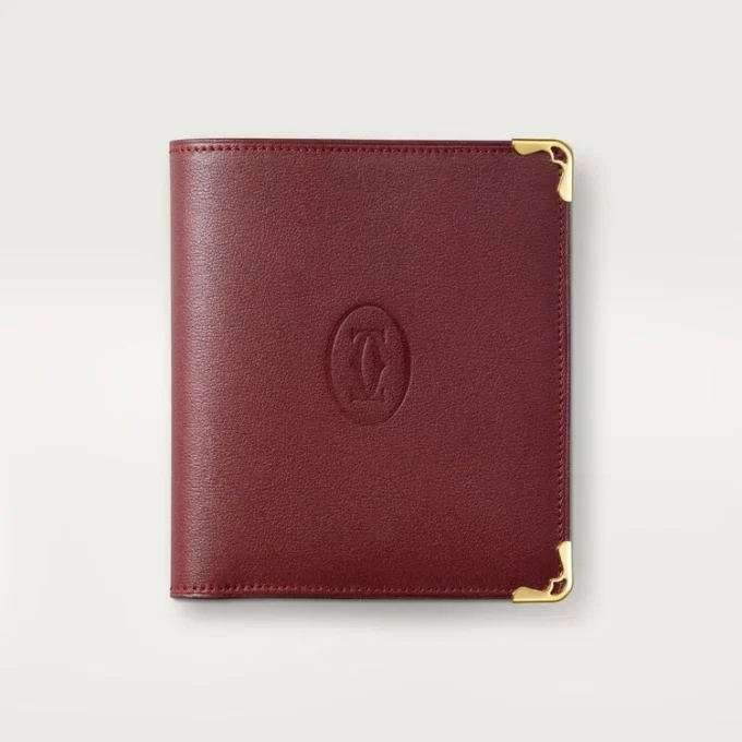 Lommebok med flere lommer, Must De Cartier – burgunderfarget kalveskinn, gullfinish – Cartier