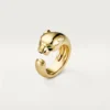 Panthere De Cartier-ring – gult gull, onyx, tsavorittgranat – Cartier