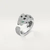 Panthere De Cartier-ring – hvitt gull, smaragder, onyx, diamanter – Cartier
