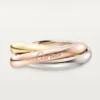 Trinity-ring i trefarget gull, klassisk modell | Cartier Us Trinity-ring i trefarget gull, klassisk modell | Cartier Us
